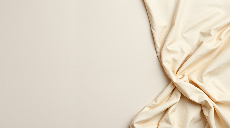 Pale sand-coloured raw silk laid flat, with soft folds at the right edge